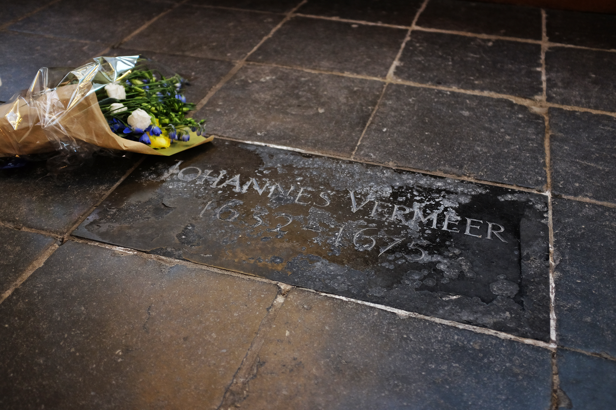 Small grave marker and flowers